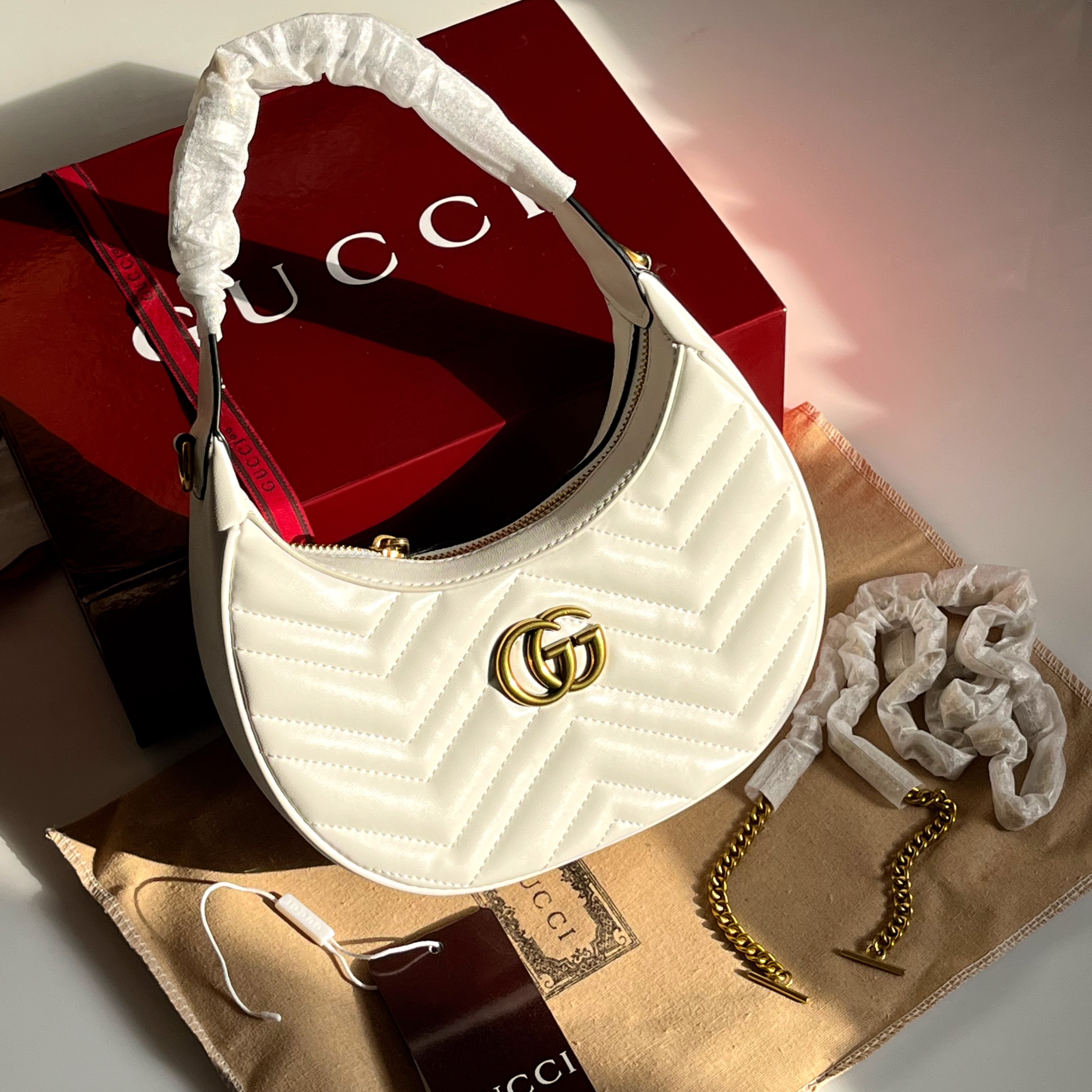 Gucci GG Marmont Matelassé Crescent Shoulder Bag