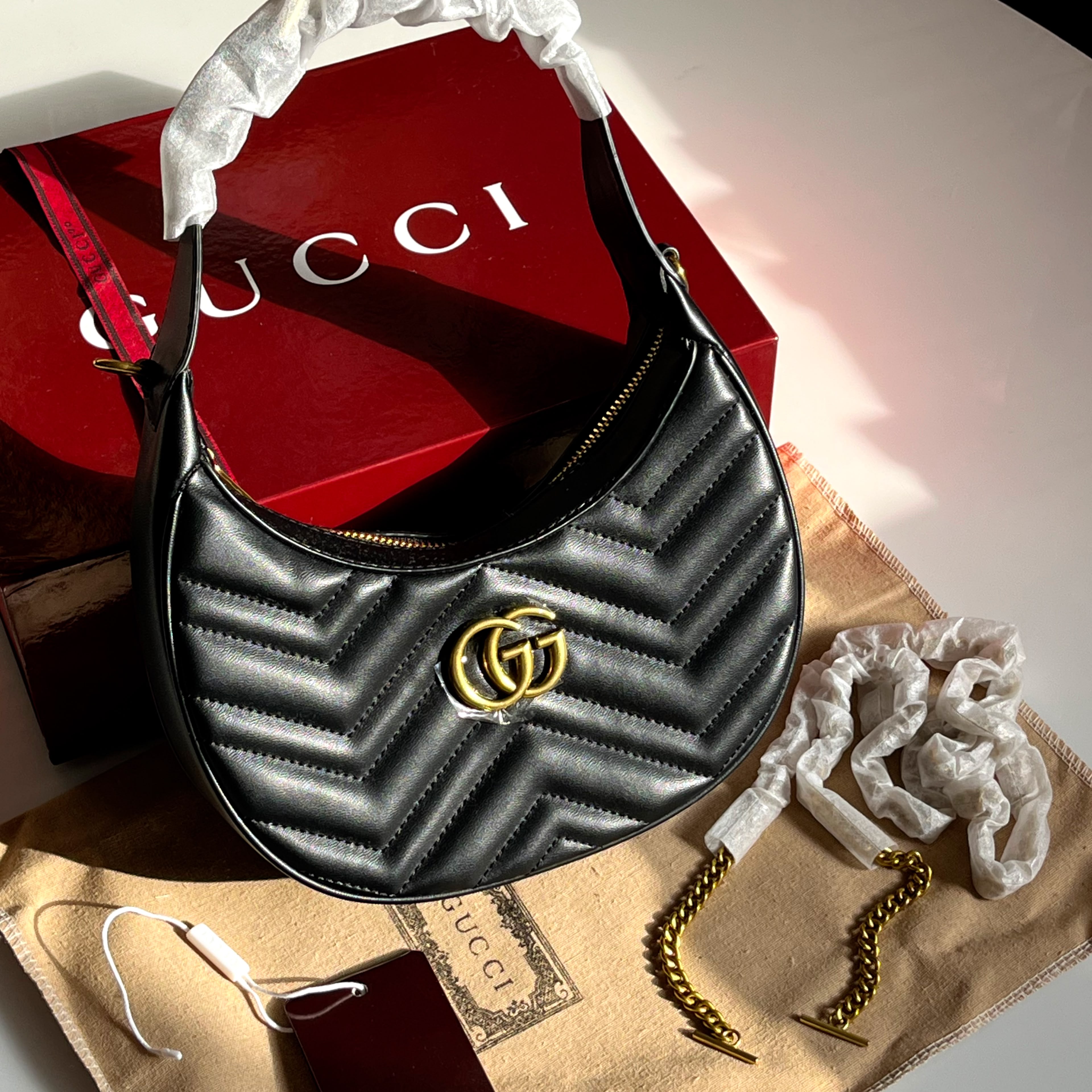 Gucci GG Marmont Matelassé Crescent Shoulder Bag